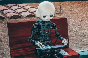 Robotic child reading and learning to illustrate Artificial Intelligence and Machine Learning