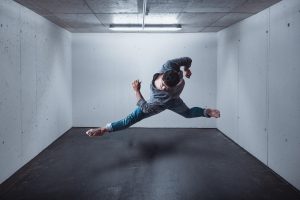 Male dancer in arieal spin, demonstrating flexibility